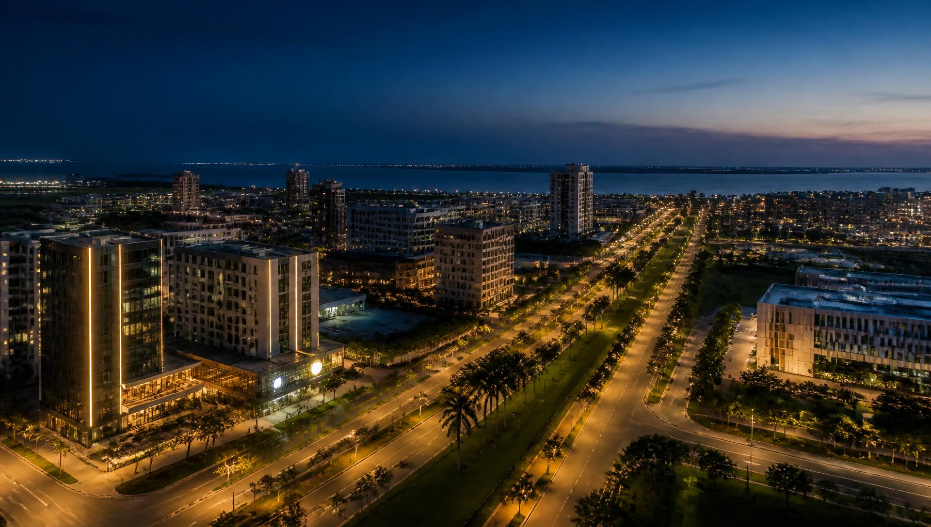 Dusk aerial view of a masterplanned city district
